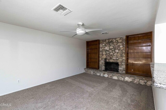 4713 Perris Way, Bakersfield, CA 93309 - unfurnished living room featuring ceiling fan, carpet flooring, built in features, and a fireplace