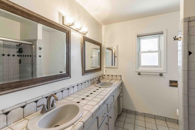 4713 Perris Way, Bakersfield, CA 93309 - full bath featuring tile patterned flooring, double vanity, and a stall shower