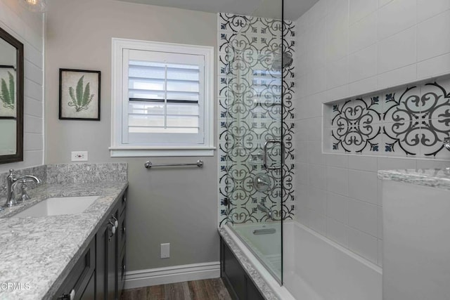 13305 San Simeon Ave, Bakersfield, CA 93314 - full bath with vanity, wood finished floors, and tiled shower / bath combo