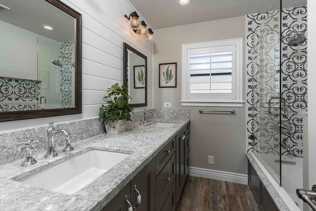 13305 San Simeon Ave, Bakersfield, CA 93314 - full bath featuring double vanity, wood finished floors, and tiled shower / bath