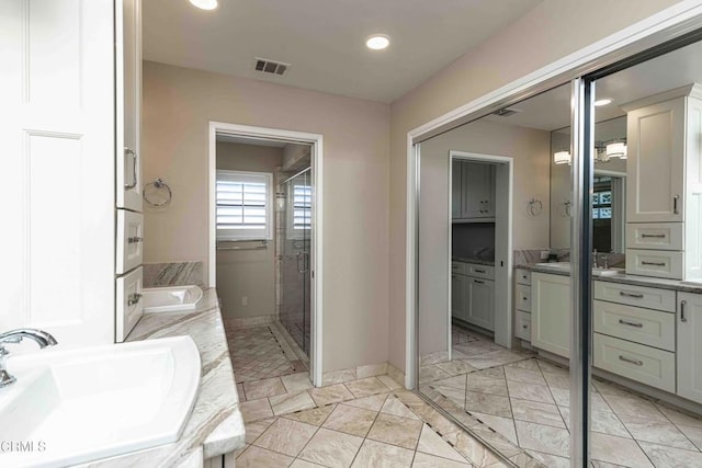 13305 San Simeon Ave, Bakersfield, CA 93314 - full bath featuring double vanity, a stall shower, and recessed lighting