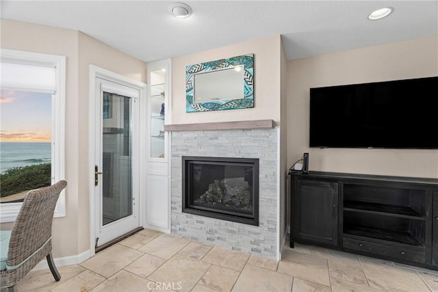 9229 Balboa Ave Unit 4, San Simeon, CA 93452 - living area with a stone fireplace and a water view