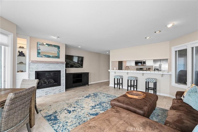 9229 Balboa Ave Unit 4, San Simeon, CA 93452 - living area with a stone fireplace and recessed lighting