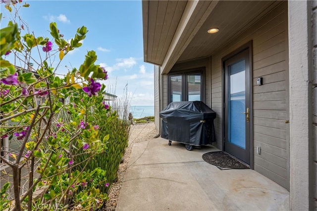 9229 Balboa Ave Unit 4, San Simeon, CA 93452 - view of patio / terrace with a grill and a water view