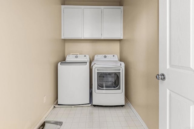 11337 Vista Elevada, San Diego, CA 92131 - laundry room featuring cabinet space, washing machine and clothes dryer, and light tile patterned floors