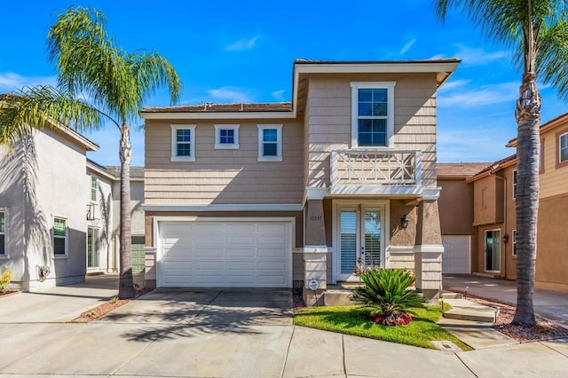 11337 Vista Elevada, San Diego, CA 92131 - view of property with a balcony, driveway, a garage, and stucco siding