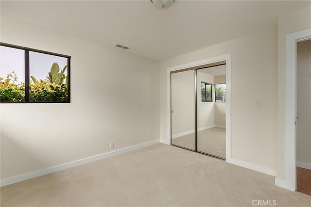 125 Park Pl, Pismo Beach, CA 93449 - unfurnished bedroom with light colored carpet and a closet