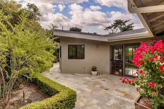 125 Park Pl, Pismo Beach, CA 93449 - property entrance featuring a patio area and stucco siding