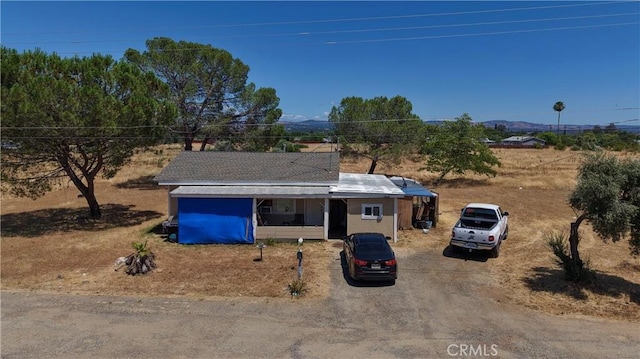 2048 10th St, Oroville, CA 95965 - view of front of property with dirt driveway and a mountain view