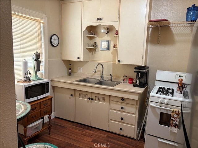 2048 10th St, Oroville, CA 95965 - kitchen with white appliances, light countertops, and dark wood-style floors