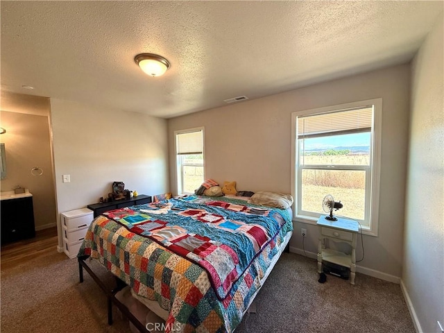 2048 10th St, Oroville, CA 95965 - bedroom with carpet flooring and a textured ceiling