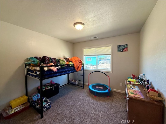 2048 10th St, Oroville, CA 95965 - carpeted bedroom with a textured ceiling and baseboards