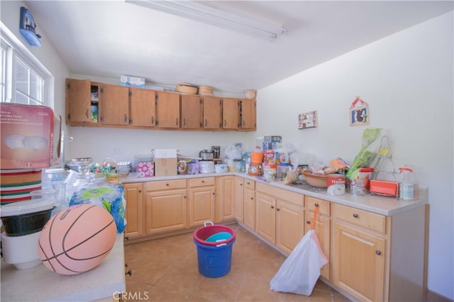 2509 Euclid E, Upland, CA 91784 - kitchen with light countertops, light brown cabinetry, and light tile patterned flooring