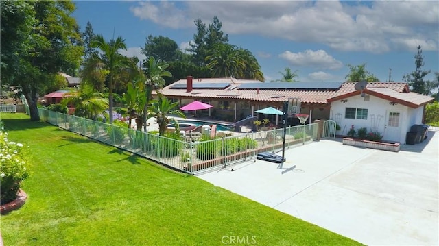 2509 Euclid E, Upland, CA 91784 - back of property featuring a patio, solar panels, a fenced backyard, a tiled roof, and stucco siding