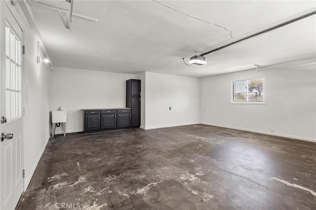 7573 Cibola Trl, Yucca Valley, CA 92284 - garage with a garage door opener and baseboards