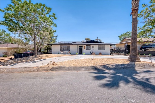 7573 Cibola Trl, Yucca Valley, CA 92284 - single story home featuring solar panels and stucco siding