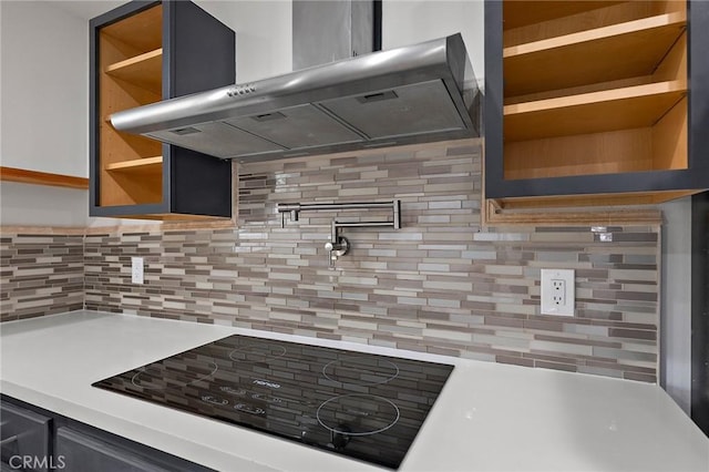 7573 Cibola Trl, Yucca Valley, CA 92284 - kitchen featuring wall chimney range hood, open shelves, backsplash, and light countertops