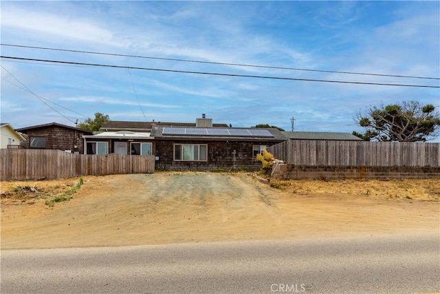 971 Ramona Ave, Los Osos, CA 93402 - single story home featuring solar panels, a chimney, and driveway