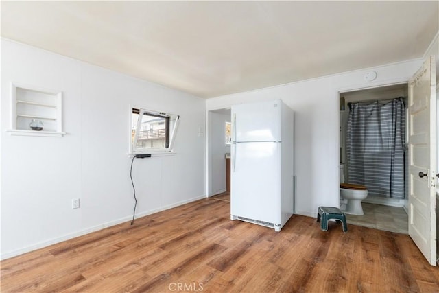 971 Ramona Ave, Los Osos, CA 93402 - unfurnished bedroom with freestanding refrigerator, light wood finished floors, and ensuite bathroom