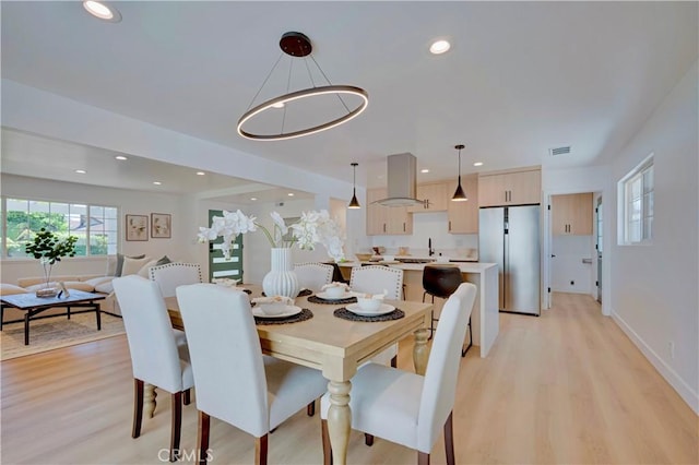 1810 N 2nd Ave, Upland, CA 91784 - dining room with light wood-style floors and recessed lighting