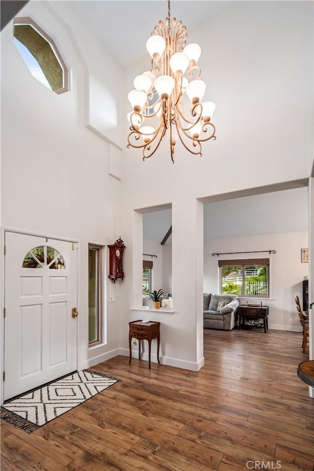 2575 Palomino Dr, Acton, CA 93510 - foyer featuring a high ceiling, a chandelier, and wood-type flooring