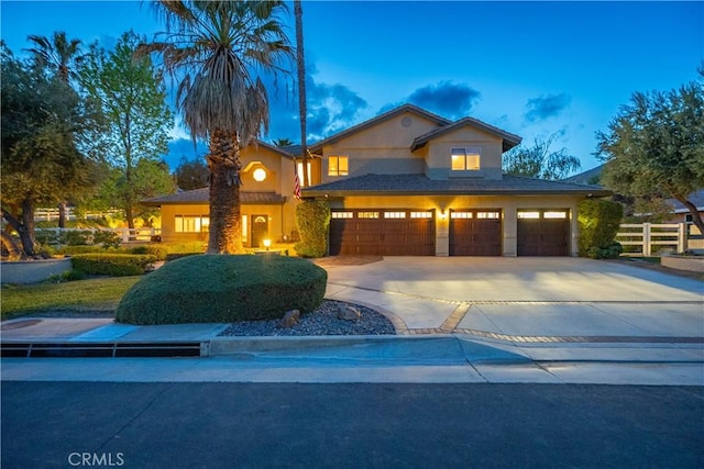 2575 Palomino Dr, Acton, CA 93510 - view of front of house with an attached garage, driveway, and stucco siding
