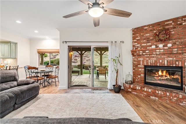 2575 Palomino Dr, Acton, CA 93510 - living room featuring wood finished floors, ornamental molding, a fireplace, ceiling fan, and recessed lighting