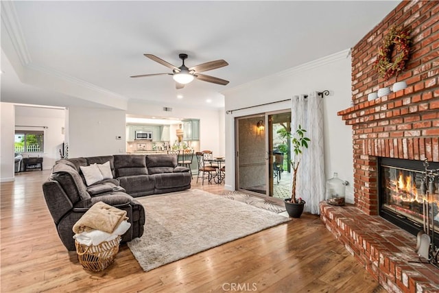 2575 Palomino Dr, Acton, CA 93510 - living room with ceiling fan, plenty of natural light, ornamental molding, wood finished floors, and a fireplace