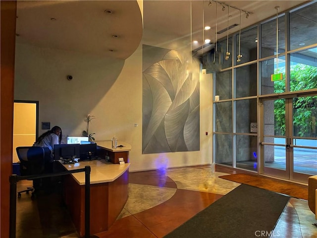 801 S Grand Ave Unit 1608, Los Angeles, CA 90017 - tiled home office with track lighting, a high ceiling, and french doors