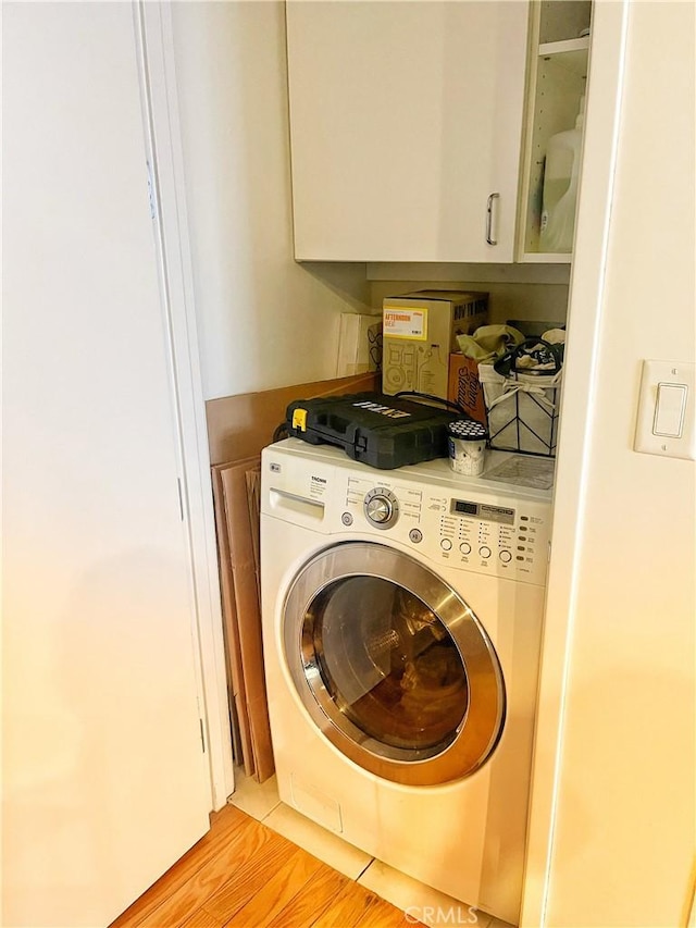 801 S Grand Ave Unit 1608, Los Angeles, CA 90017 - laundry room with washer / clothes dryer and cabinet space