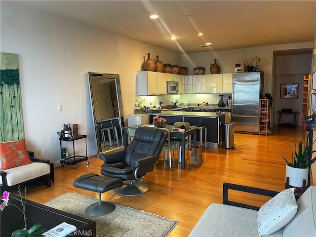 801 S Grand Ave Unit 1608, Los Angeles, CA 90017 - living area with light wood-style floors and recessed lighting