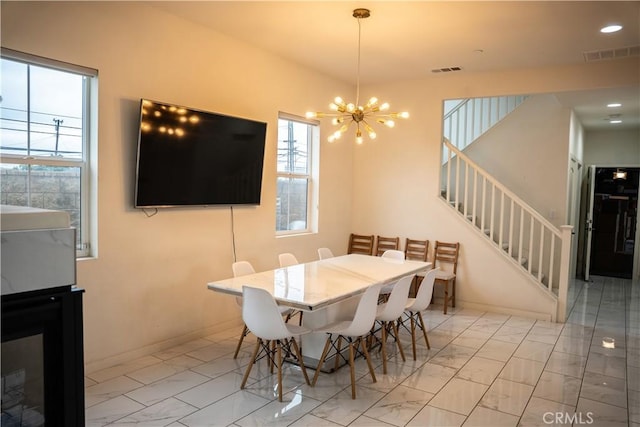 21125 Normandie Ave, Torrance, CA 90501 - dining space featuring a chandelier, light marble finish flooring, stairs, and recessed lighting