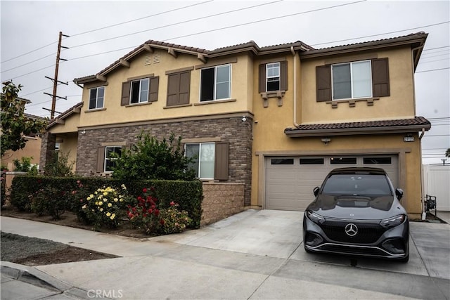 21125 Normandie Ave, Torrance, CA 90501 - view of front of home featuring driveway, stucco siding, and an attached garage