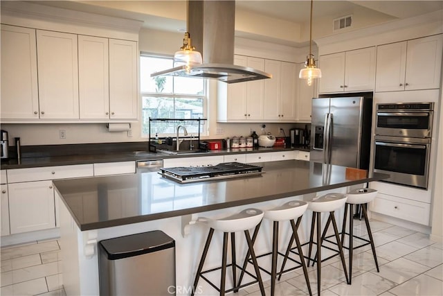 21125 Normandie Ave, Torrance, CA 90501 - kitchen with stainless steel appliances, island exhaust hood, dark countertops, a center island, and white cabinetry