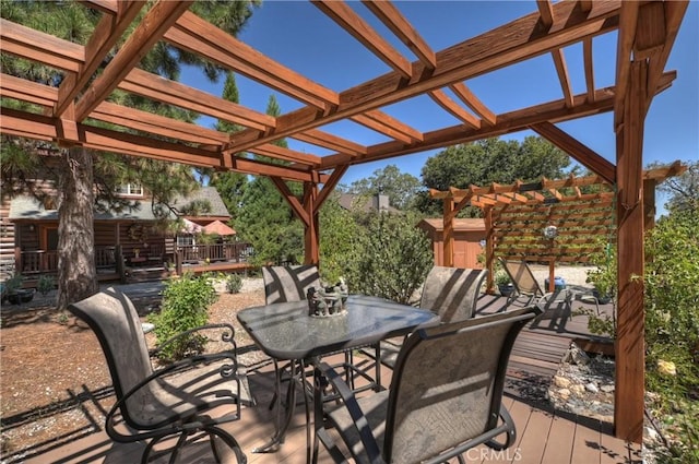 1415 Manzanita Way, Lake Arrowhead, CA 92352 - wooden terrace featuring outdoor dining area and a pergola