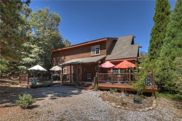 1415 Manzanita Way, Lake Arrowhead, CA 92352 - view of front of house featuring a shingled roof and a deck