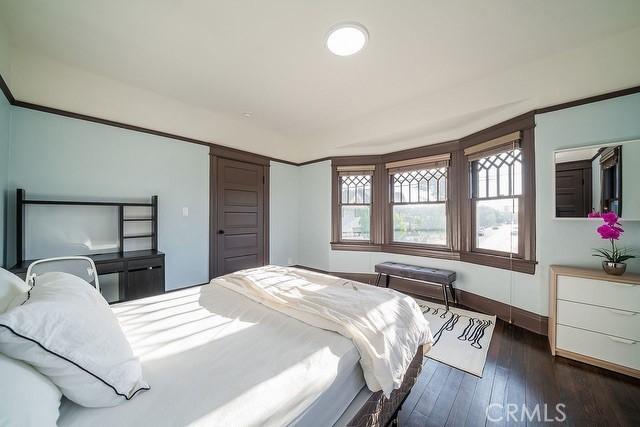 2109 Toberman St, Los Angeles, CA 90007 - bedroom with dark wood-style floors and baseboards