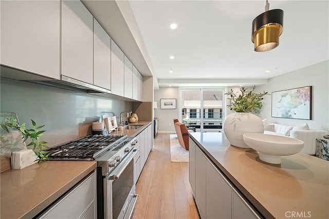 39 S Los Robles Ave Unit 6010, Pasadena, CA 91101 - kitchen featuring gas stove, light wood-style floors, white cabinets, open floor plan, and recessed lighting