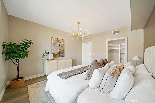39 S Los Robles Ave Unit 6010, Pasadena, CA 91101 - bedroom with wood finished floors, a chandelier, and a walk in closet
