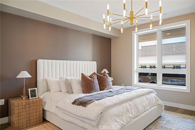 39 S Los Robles Ave Unit 6010, Pasadena, CA 91101 - bedroom featuring wood finished floors and a chandelier