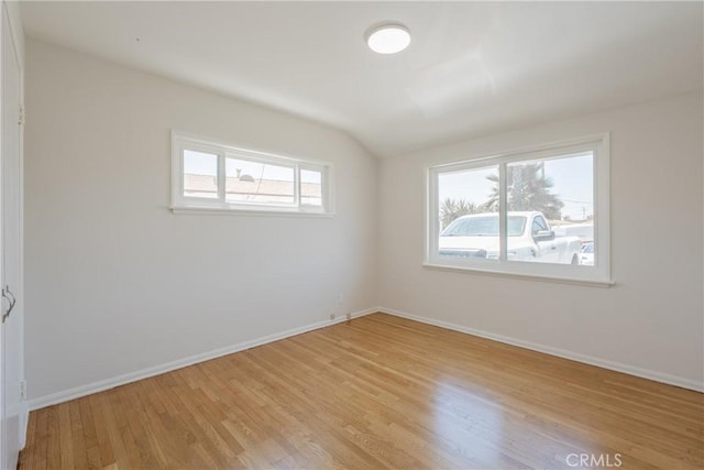 14314 De Alcala Dr, La Mirada, CA 90638 - spare room featuring light wood-type flooring and vaulted ceiling