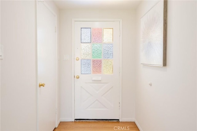 14314 De Alcala Dr, La Mirada, CA 90638 - doorway to outside featuring light wood-style flooring and baseboards