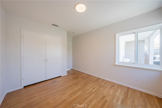 14314 De Alcala Dr, La Mirada, CA 90638 - unfurnished bedroom featuring light wood-style floors and a closet