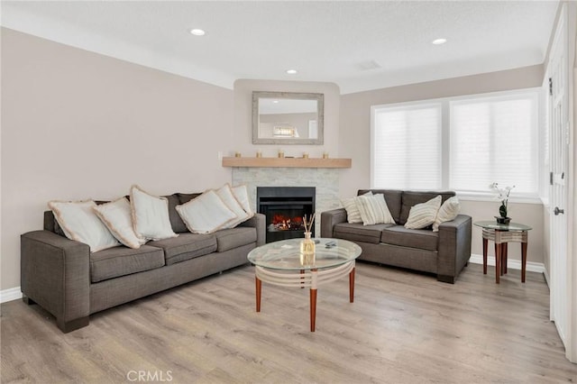 3341 Wisconsin Ave, South Gate, CA 90280 - living room with a fireplace, light wood-style floors, and recessed lighting