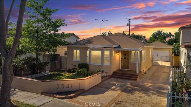 3341 Wisconsin Ave, South Gate, CA 90280 - view of front facade featuring stucco siding and driveway