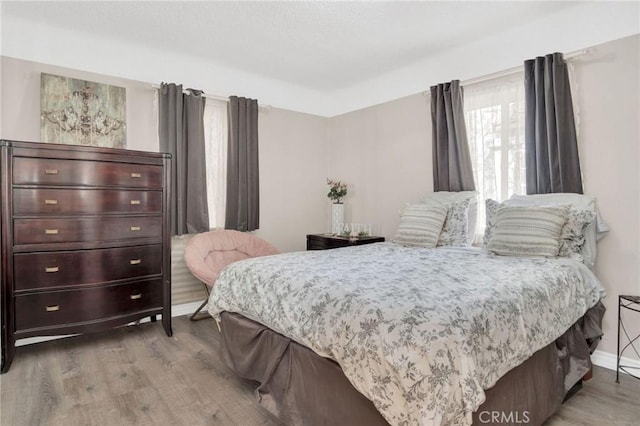 3341 Wisconsin Ave, South Gate, CA 90280 - bedroom with wood finished floors and multiple windows