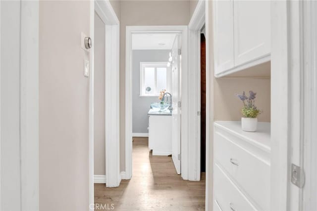 3341 Wisconsin Ave, South Gate, CA 90280 - hallway featuring light wood finished floors and baseboards