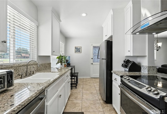 4220 Monticello Ave, Riverside, CA 92503 - kitchen featuring stainless steel appliances, extractor fan, white cabinetry, recessed lighting, and light stone countertops