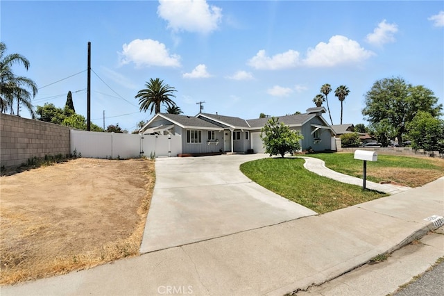 4220 Monticello Ave, Riverside, CA 92503 - ranch-style house with driveway and a gate