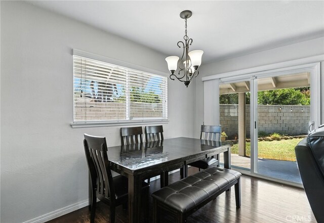 4220 Monticello Ave, Riverside, CA 92503 - dining space featuring a chandelier and dark wood-style floors